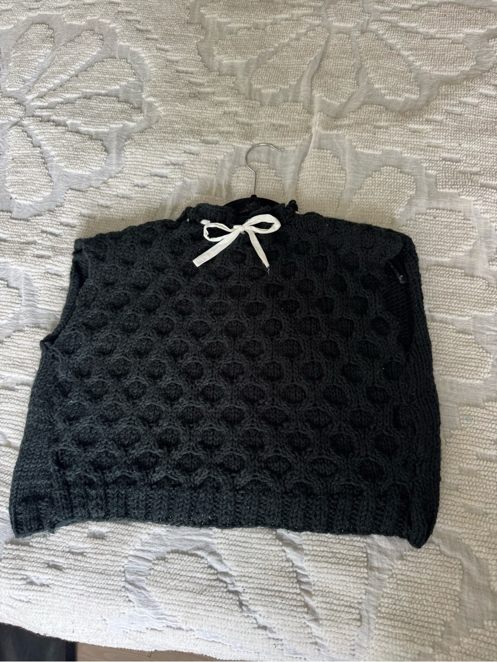 Hand knit sweater vest with contrast tie